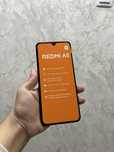 Новый смартфон Redmi в коробке.