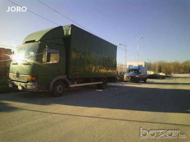 Превоз на товари и хамалски услуги с падащ борд в  страната.