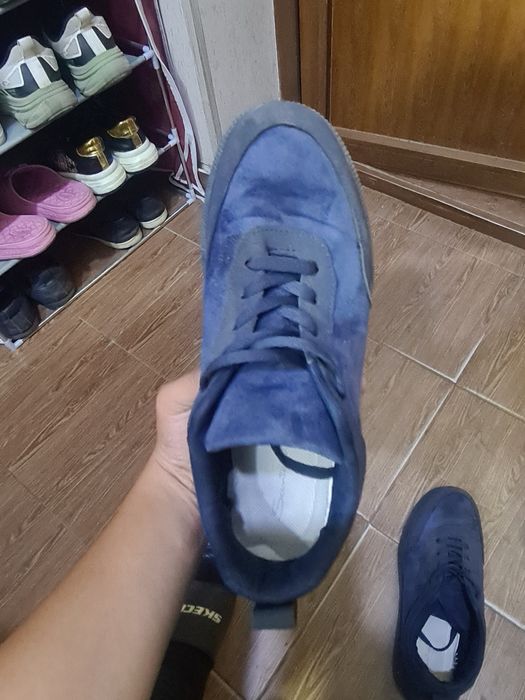 Santoni guanjo òrtacha sifat