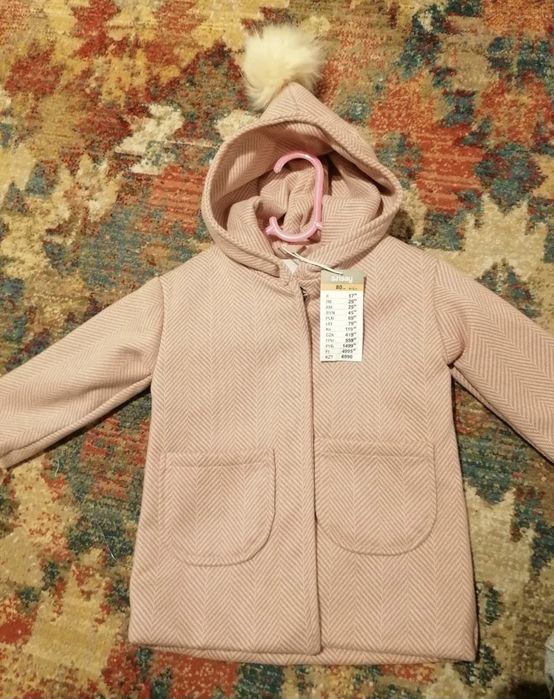 Palton nou cu eticheta