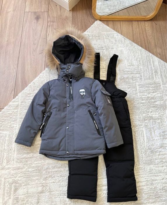 Продам детский зимний комбинезон новый