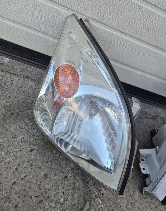 Faruri Originale Toyota Land Cruiser J120. 2002-2009.  Volan stinga.