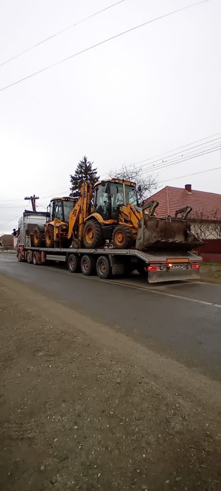 Transport marfa utilaje cu trailer dotat cu rampi