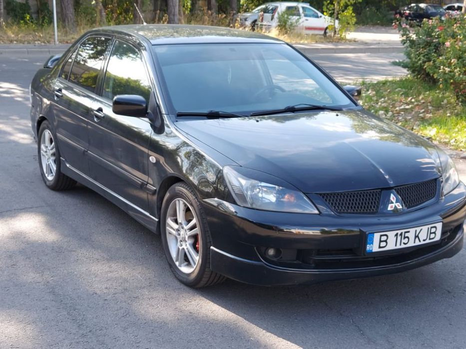 Dezmembrez Mitsubishi Lancer motor 2.0 benzina 135cp 4G63 navigatie subwoofer dezmembrari piese