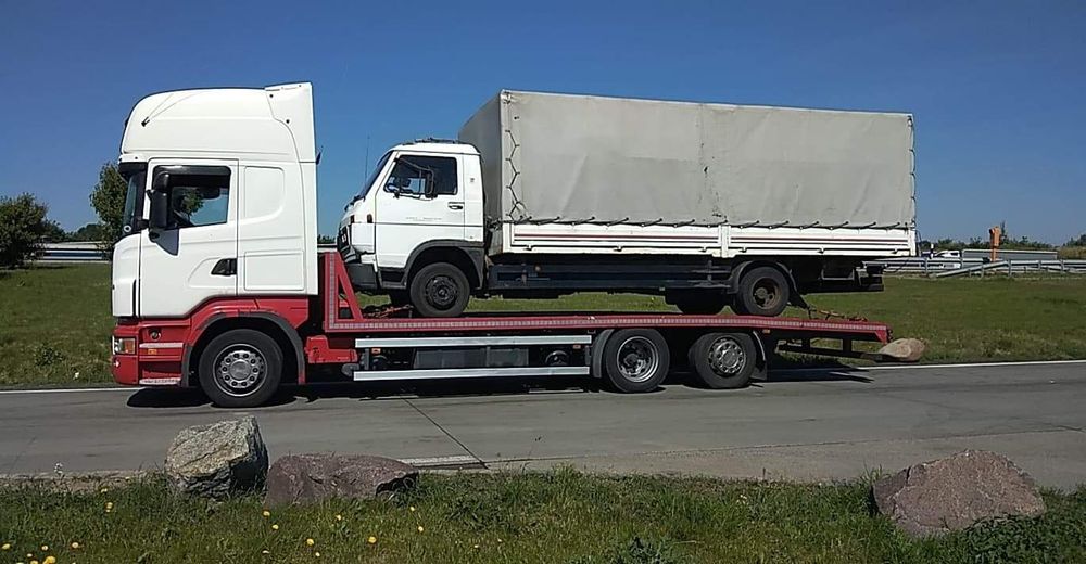 Transport utilaje . Tractări auto