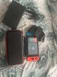 Nintendo Switch + 5 jocuri + husă + card microSD 128GB
