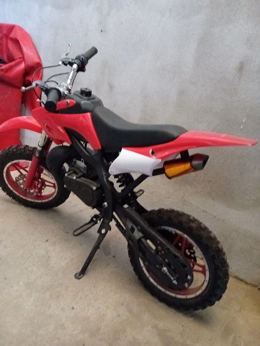 Motocicleta rosie pentru copii cu motor de 50cc