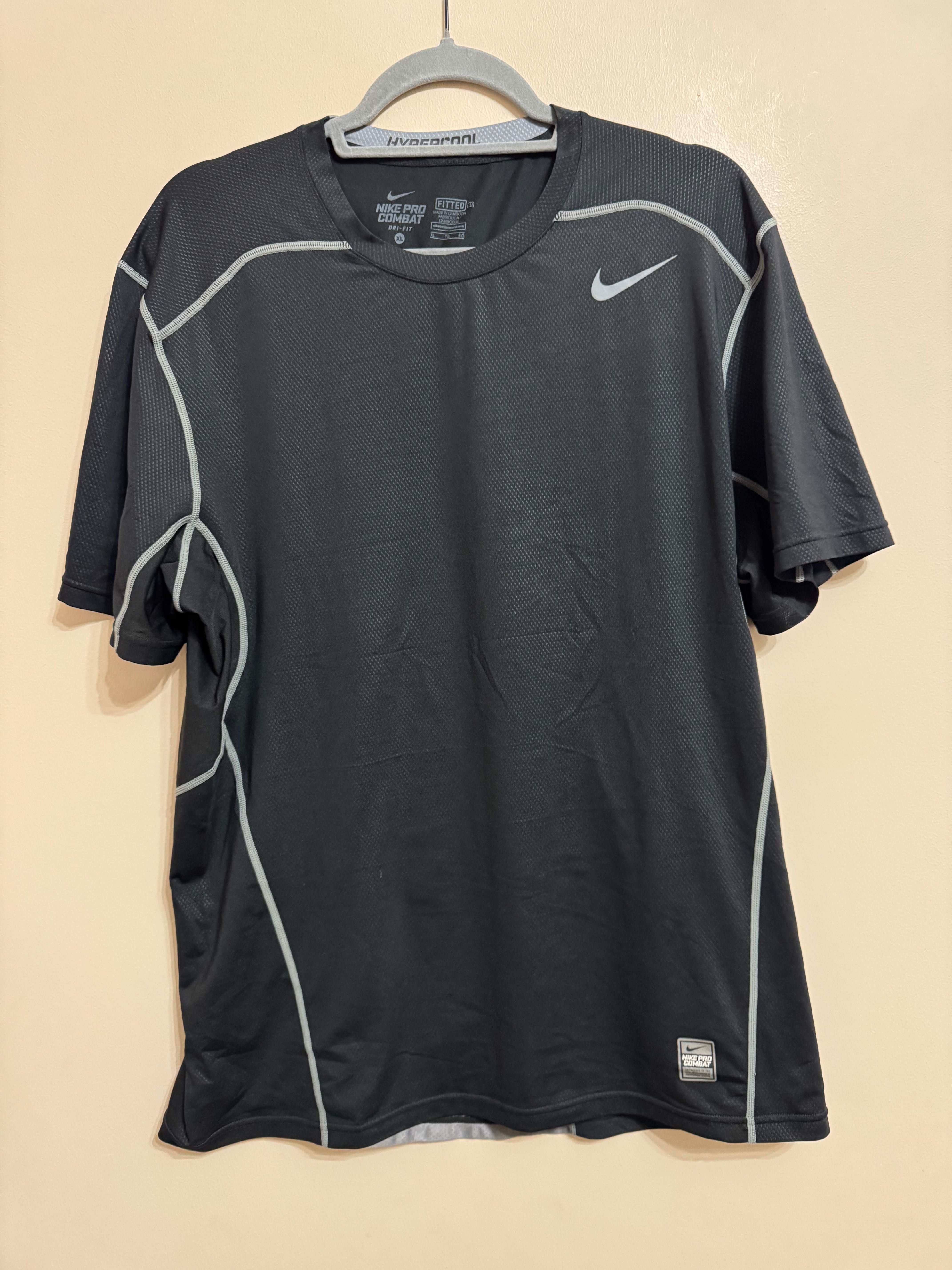 Nike Pro Combat Hypercool Fitted.          Nike Swoosh Tour Center.