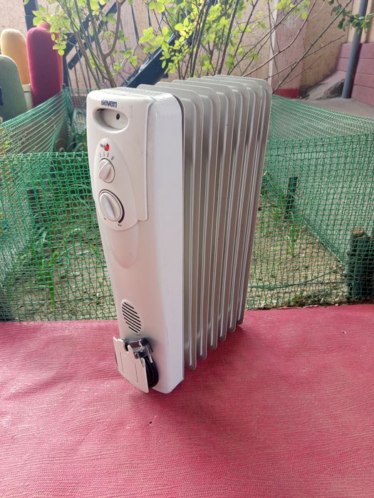 Масляный обогреватель .
