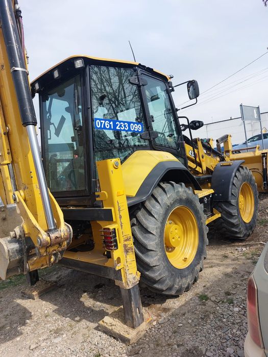 Buldoexcavator CAT NOU de inchiriat