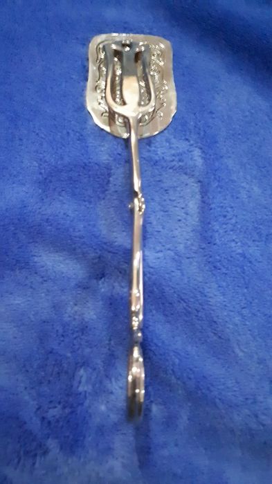 Серебряные щипцы лопатка