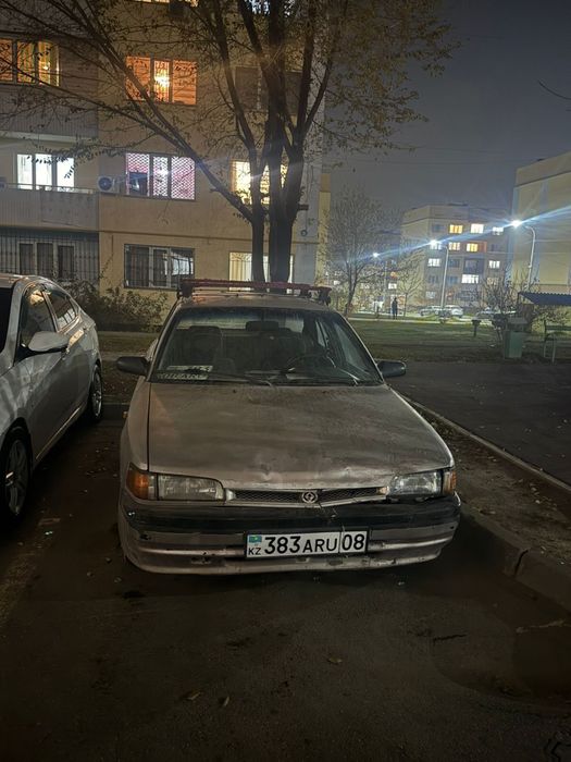 Машина мазда 323