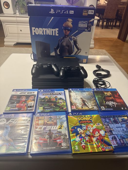 Ps 4 Pro 4K HDR 1 TB PlayStation cu 8 jocuri