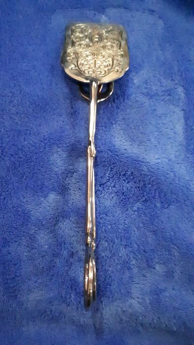 Серебряные щипцы лопатка