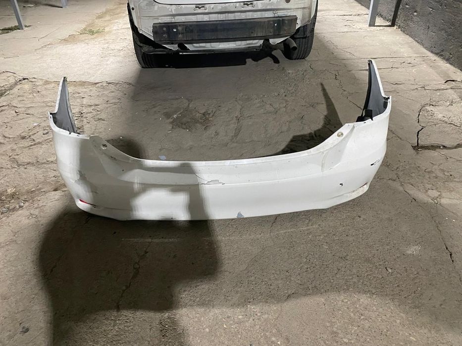Б/у задний бампер на Toyota Corolla  (E150)