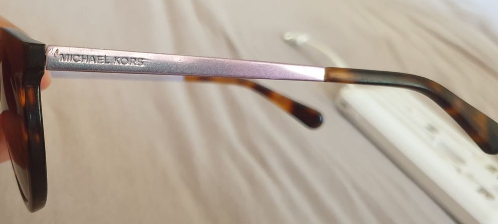 Vand ochelari Michael Kors și Police