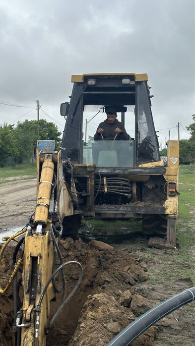 эксковатор погрузчик 3в1