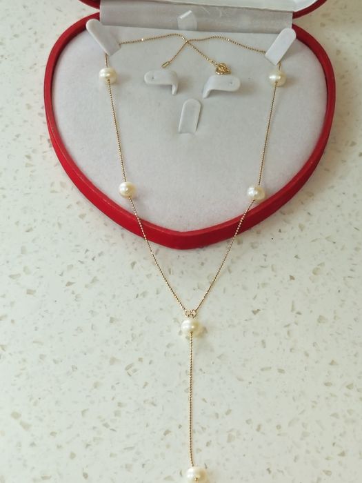 Продам новую золотую цепочки 585пр с жемчужными вставками.