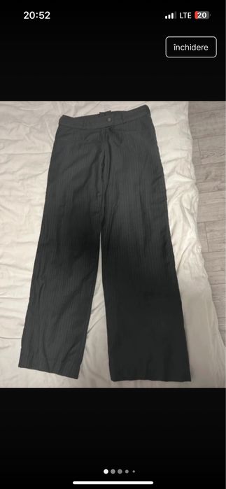 pantaloni de material evazati