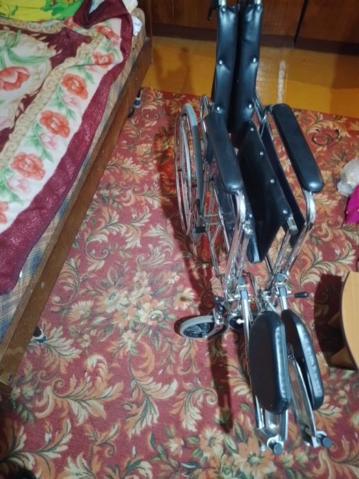 Инвалидная коляска.