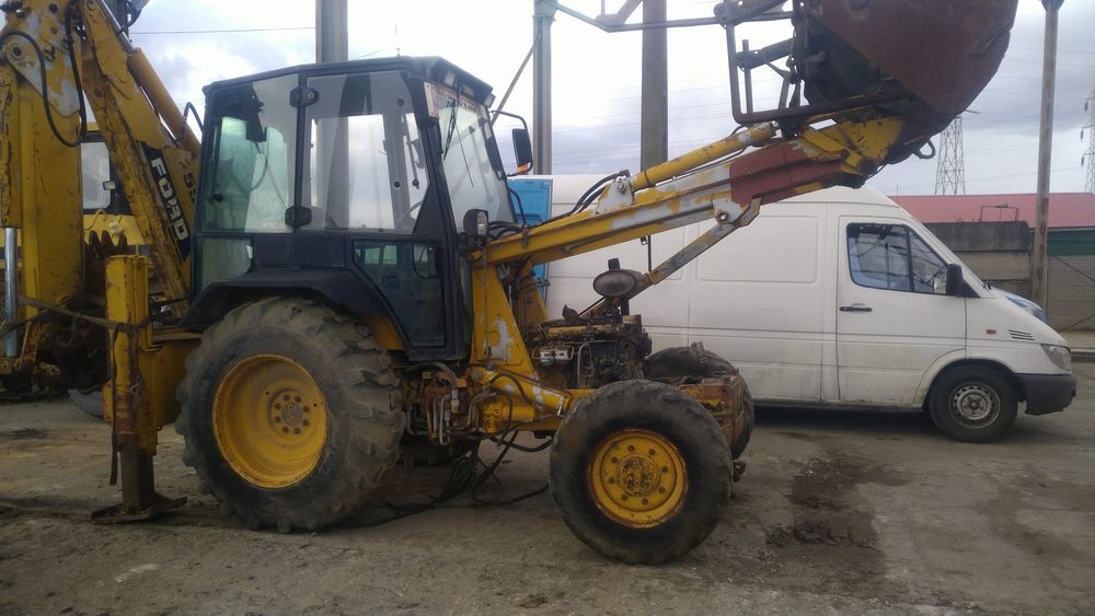 Dezmembrez buldoexcavator ford New  holland