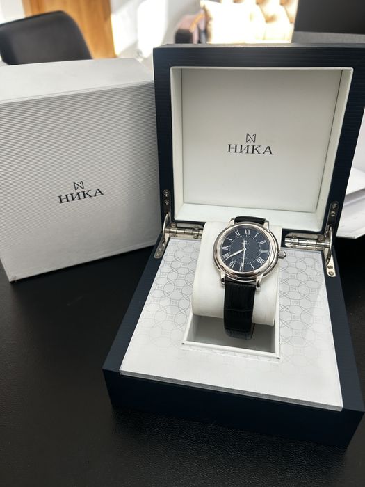 Серебрянные часы Ника