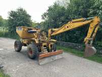 Dumper cu brat de excavare