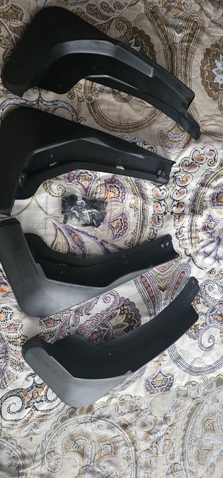 Продам новые брызговики на Geely okavango