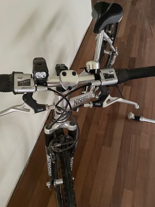 Bicicleta trekking barbati Shimano XT si bicicleta dama Nishiki Hybrid