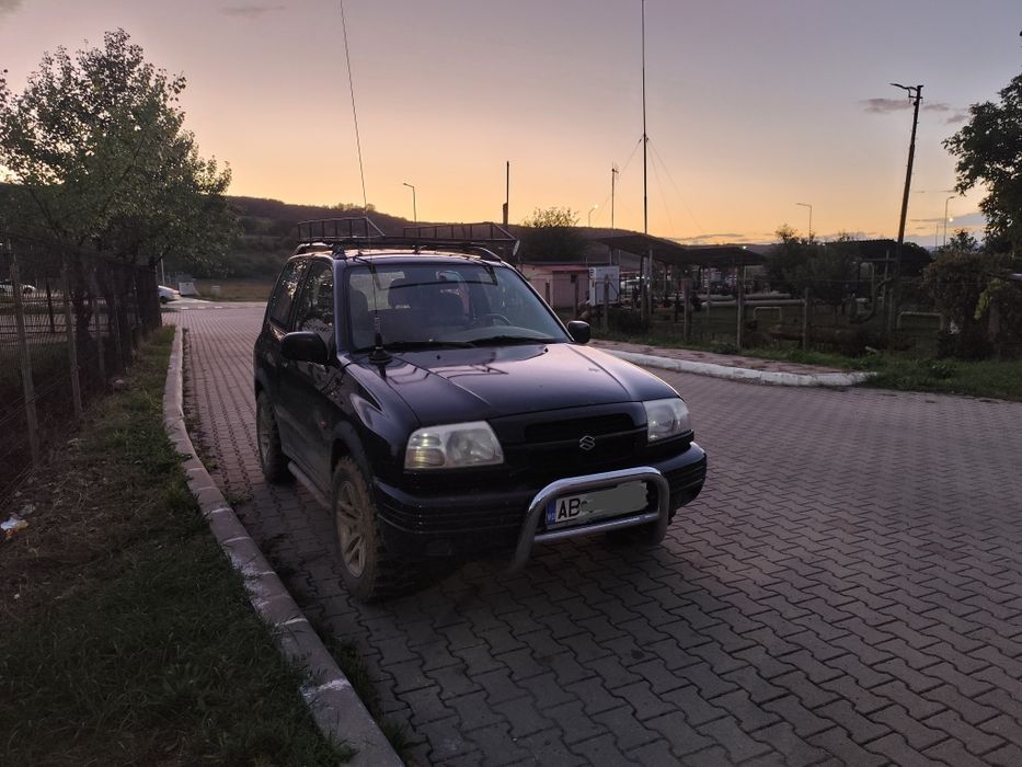 Vând s-au schimb cu atv :Suzuki grand Vitara 1