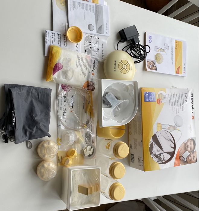 Електрическа помпа за кърма Medela Swing с всички аксесоари и подаръци