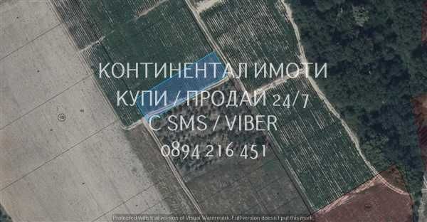код 62986. Нива 1200м2, близо до селото на 200м от последните къщи