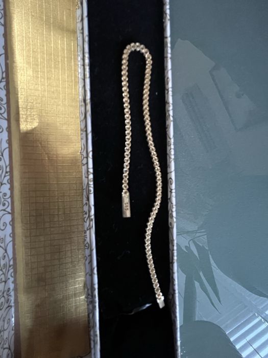 Златна тенис гривна с бял цирконий