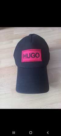Vînd șapca Hugo .