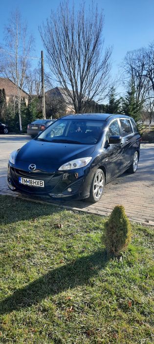 Vând Mazda noastră de Familie   ruleza excelent 7locuri  6 viteze etc.