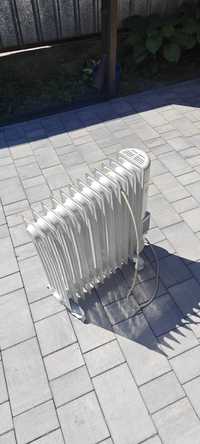 Радиатор масляный отопления электрический.