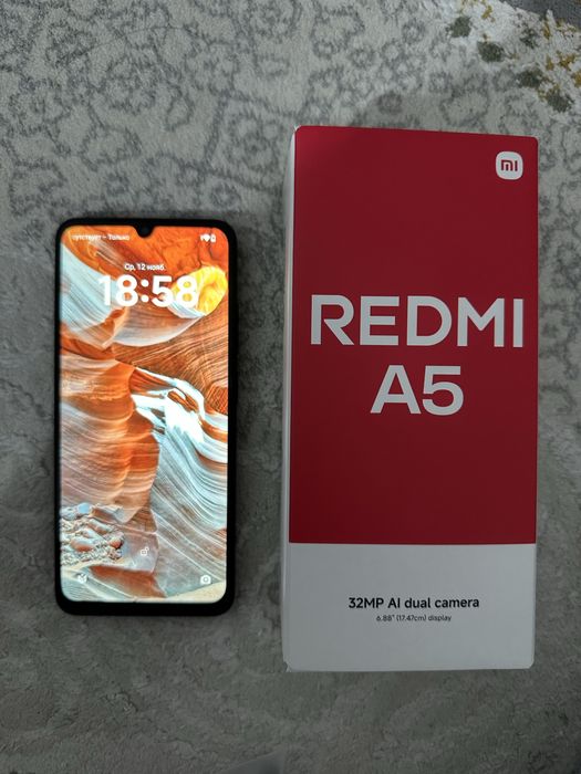 Rebmi A5 телефон, цвет черный  память 128 гб зарятка все есть