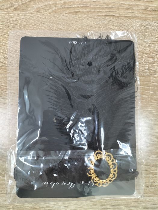 Повязка на голову с перышком