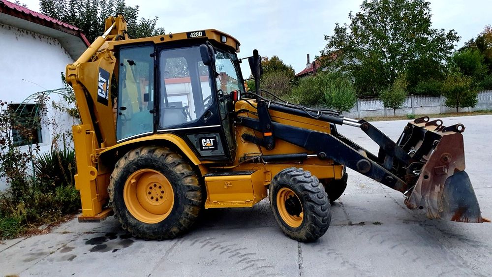 Buldoexcavator Caterpillar