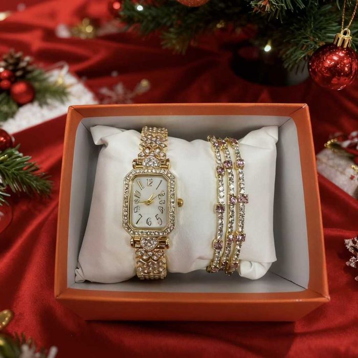Луксозен дамски комплект: часовник и гривни в златист цвят.