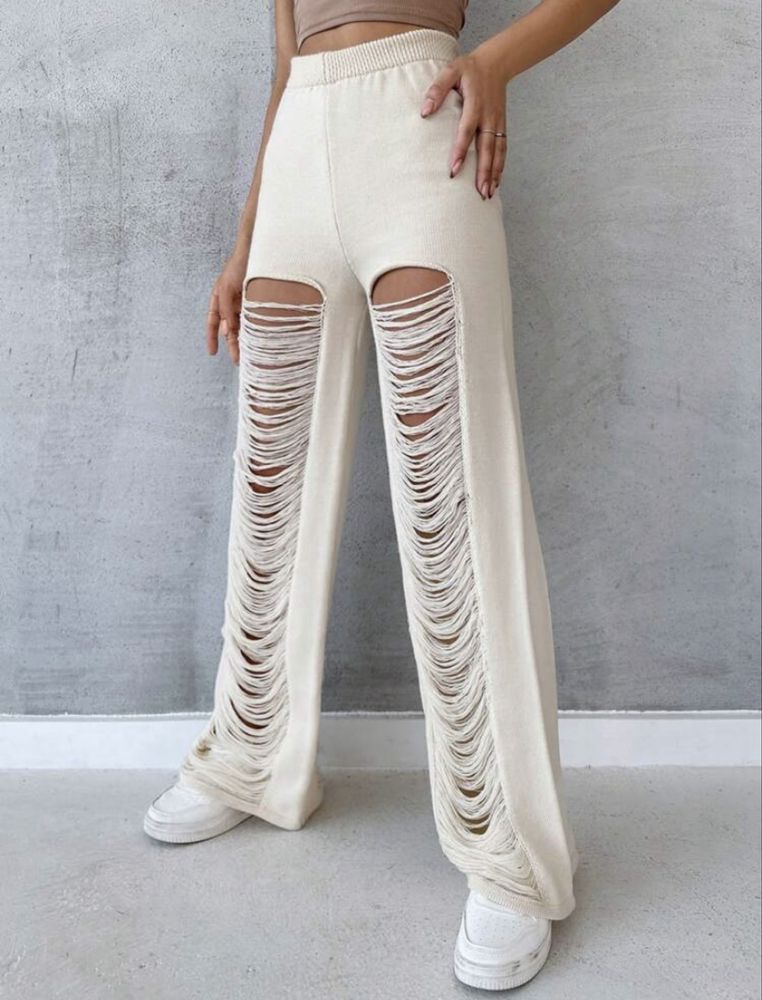 Pantaloni albi de plaja rupti