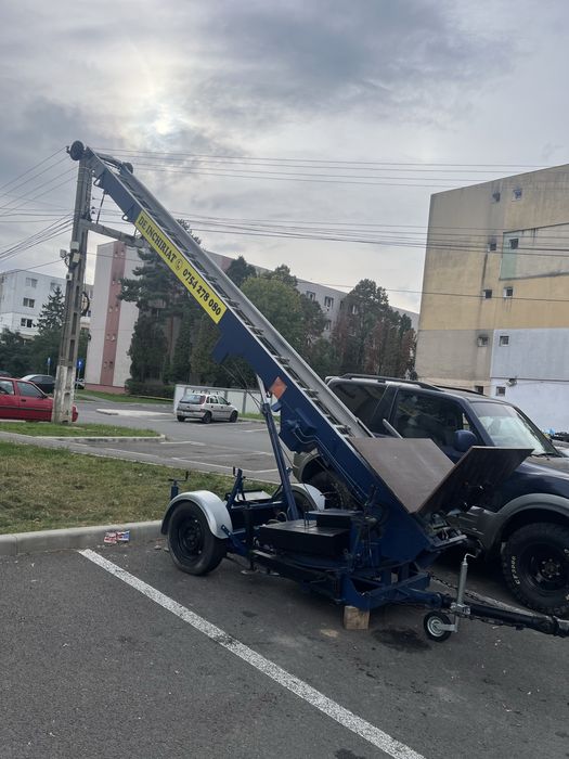 Inchirierz lift exterior tip girafa si carucior electric pentru scari