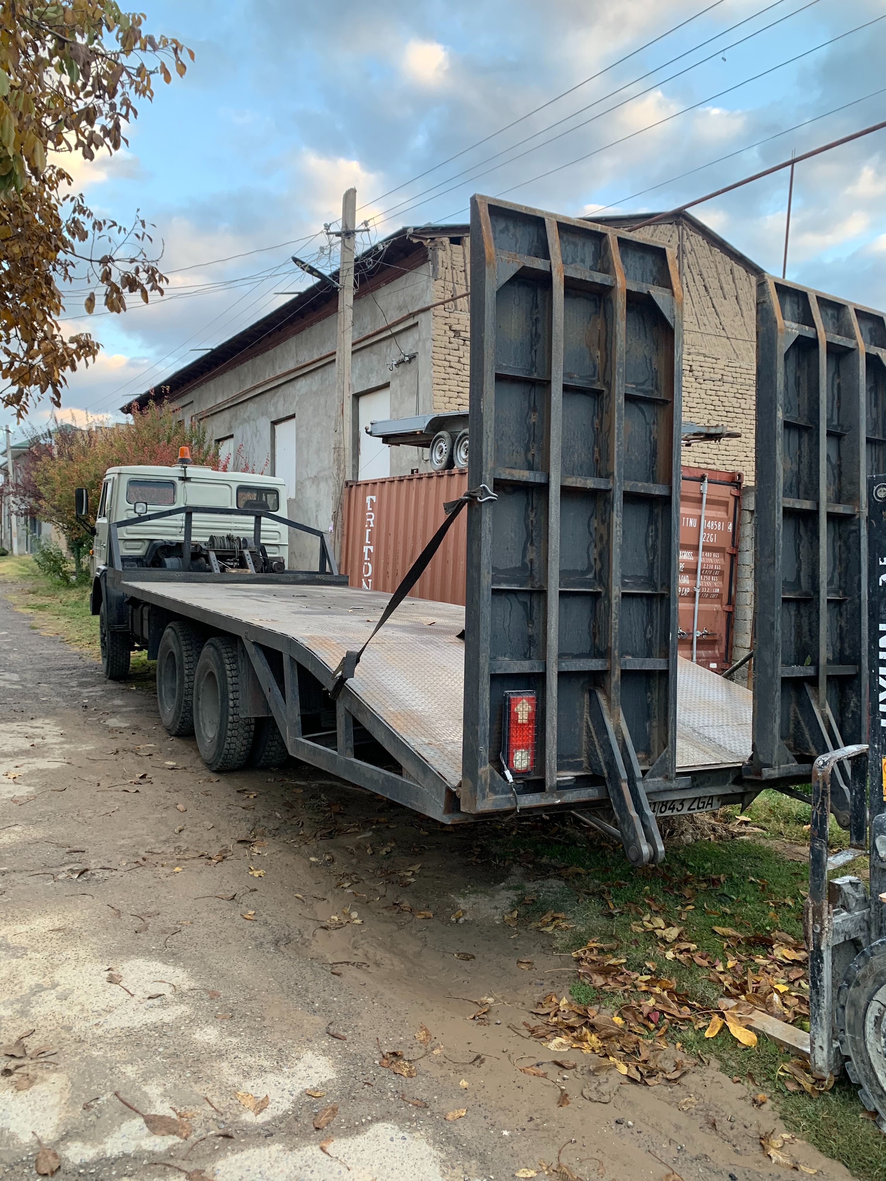 Услуги Эвакуватор перевозка кара экскаватор каток трал  трейлер