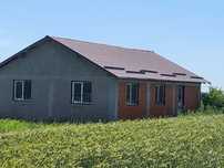 Teren 5100 mp. + casa la rosu