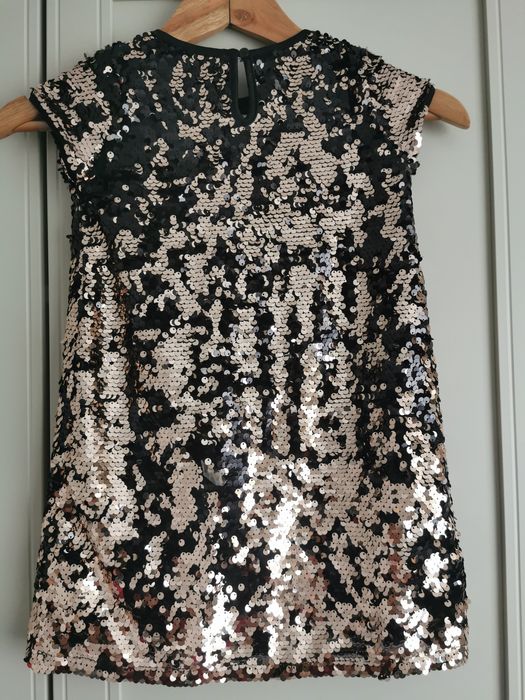 Rochita cu paiete reversibile, marime 110 (4-5 ani) 
Marime 11