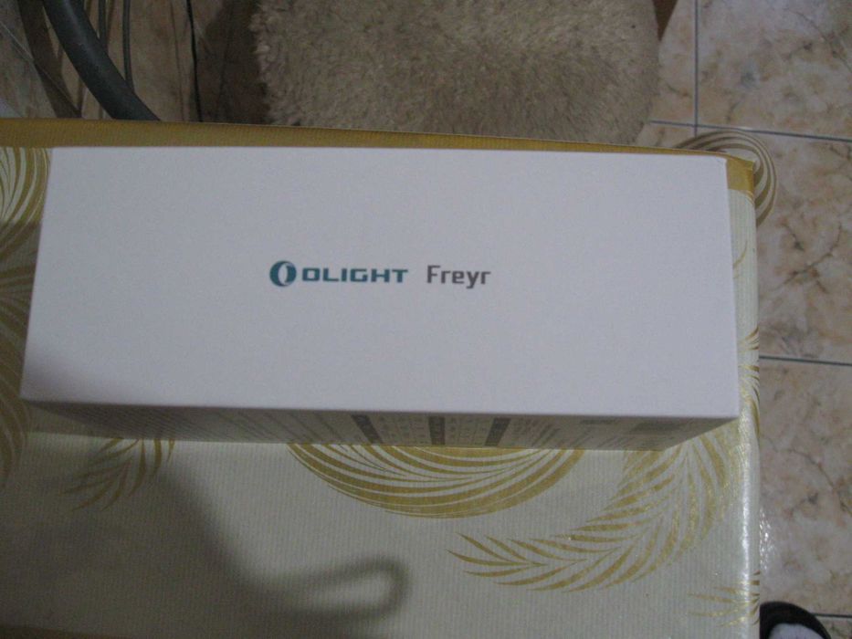 Lanterna Olight FREYR noua.