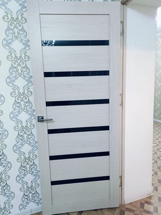 Межкомнатная дверь светло-белого цвета