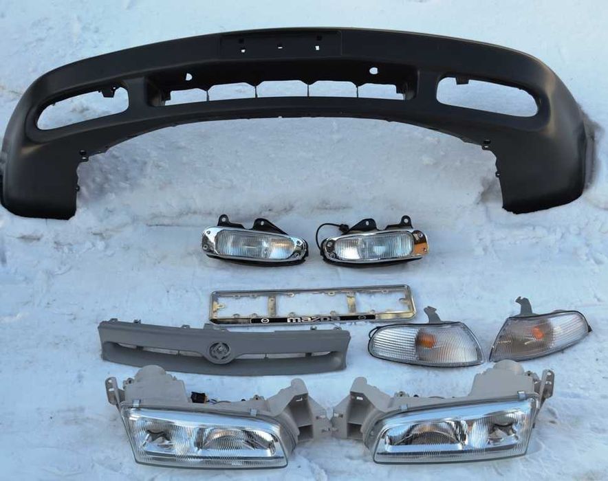 Бампер Мазда 626GE Кронос. Фары, туманки,поворотники,решетка, глушител