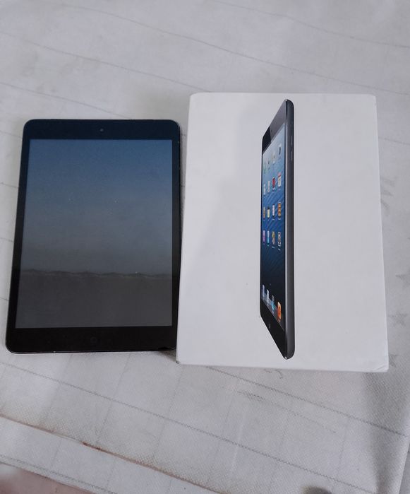 IPad Mini hotira 4 ga 32 iclod ochilgan karopka zaryatchik bor