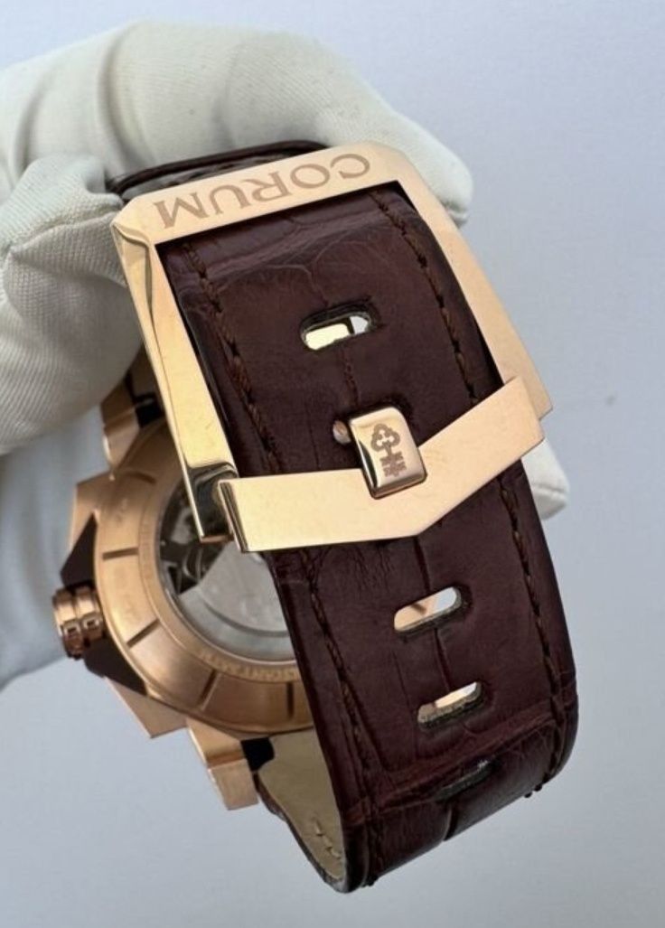 Швейцарские золотые часы Corum!